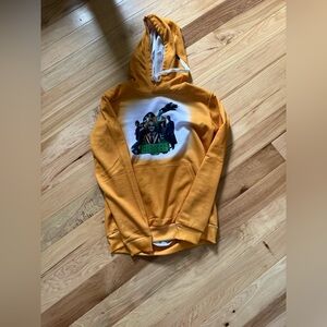 Brand new, Beetlejuice Golden sweatshirt, size small never worn, smoke-free home